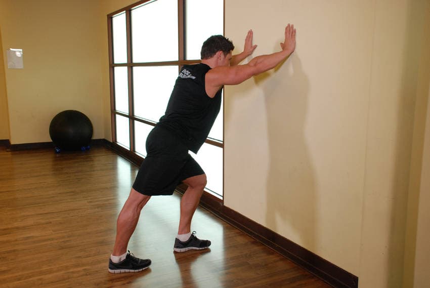 Calf Stretch Hands Against Wall — البداية