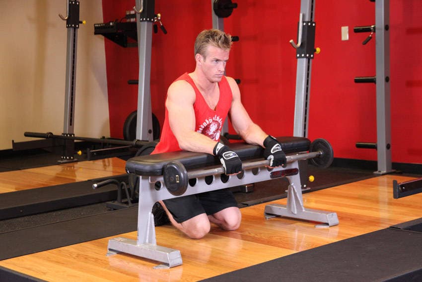 Palms-Down Wrist Curl Over A Bench — البداية
