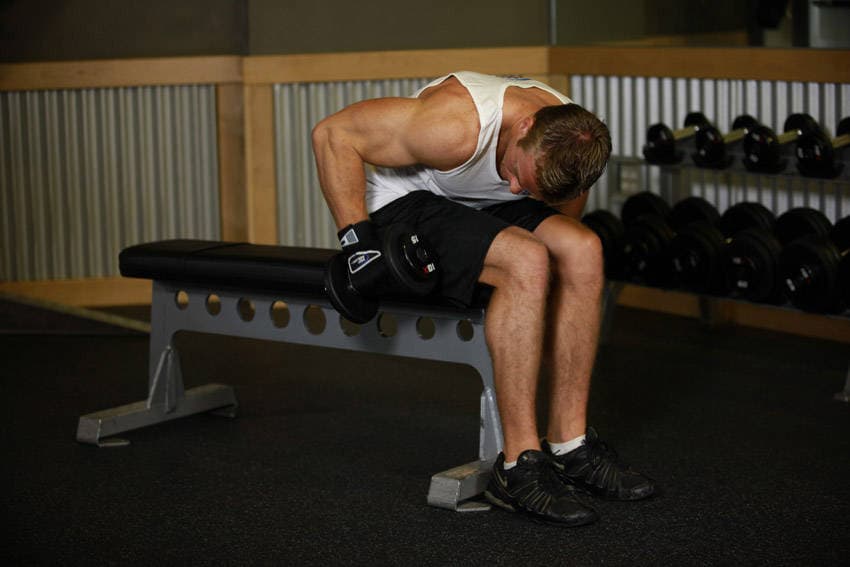 Seated Bent-Over One-Arm Dumbbell Triceps Extension — البداية