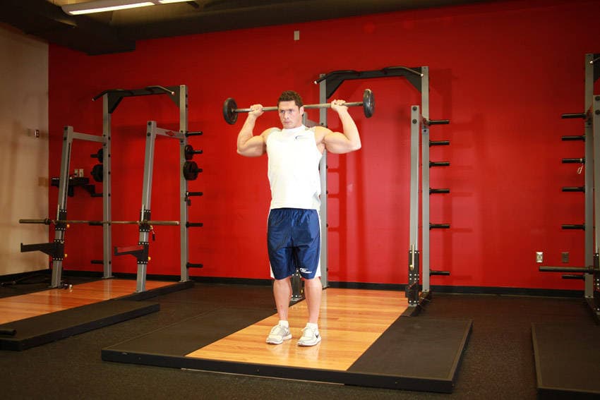 Standing Barbell Press Behind Neck — البداية