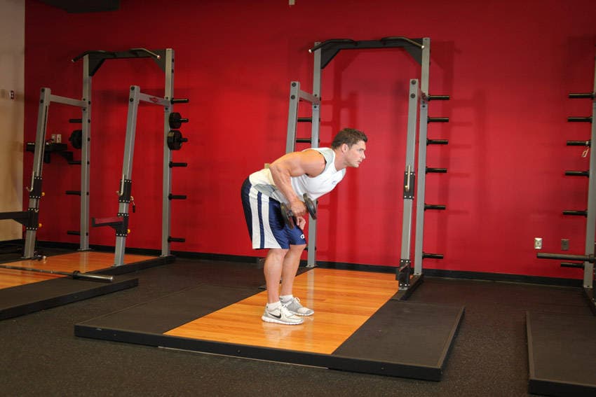 Standing Bent-Over One-Arm Dumbbell Triceps Extension — البداية