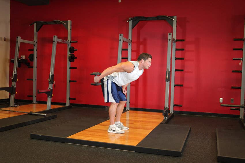 Standing Bent-Over One-Arm Dumbbell Triceps Extension — النهاية