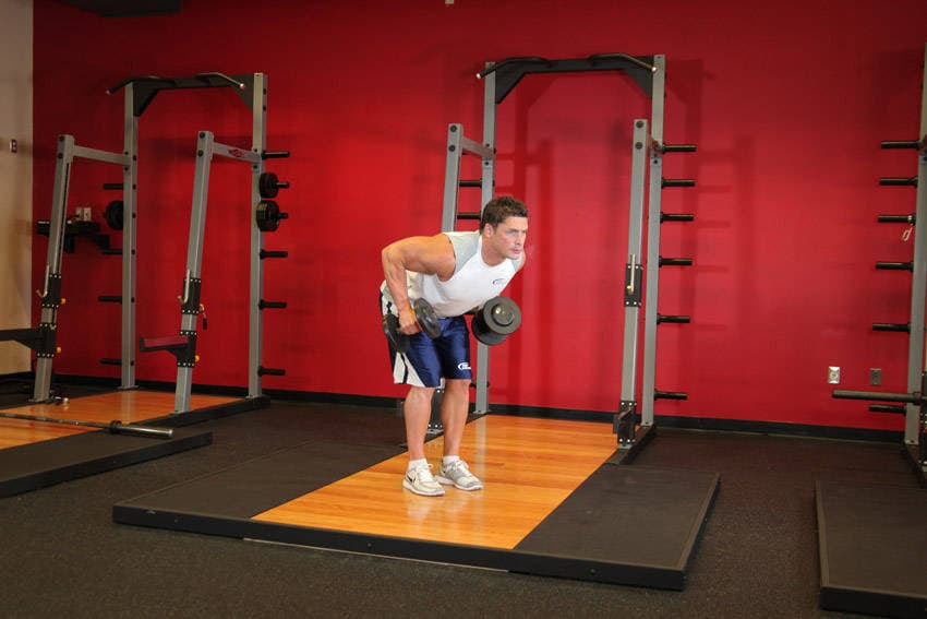 Standing Bent-Over Two-Arm Dumbbell Triceps Extension — البداية