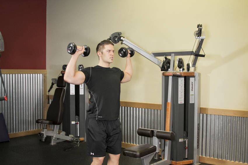 Standing Dumbbell Press — البداية