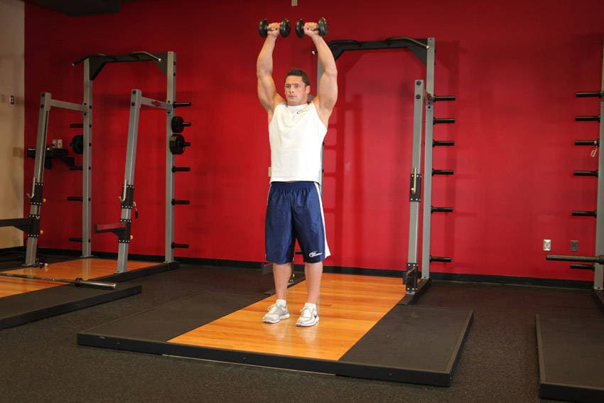 Standing Dumbbell Straight-Arm Front Delt Raise Above Head — النهاية