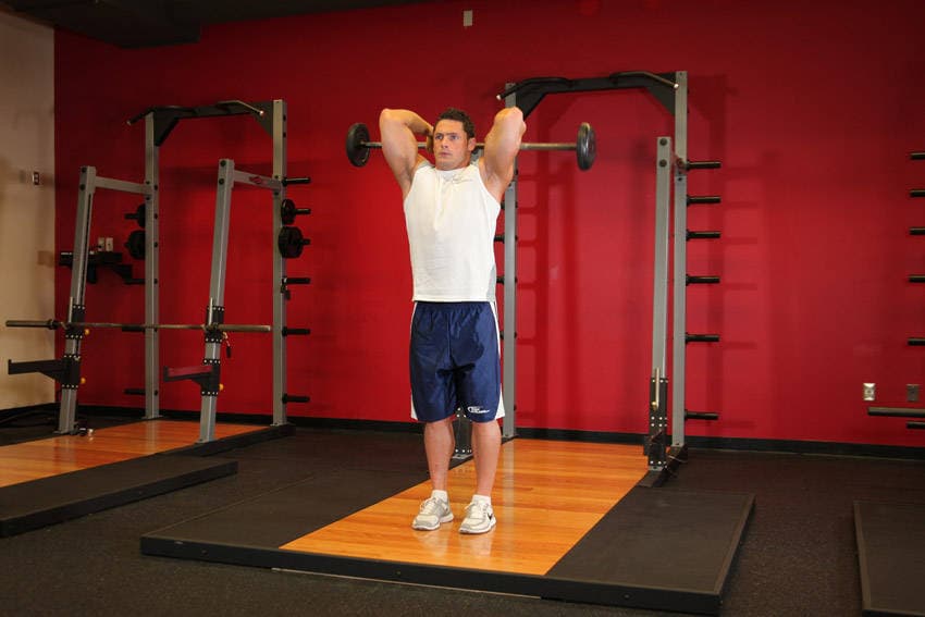 Standing Overhead Barbell Triceps Extension — البداية